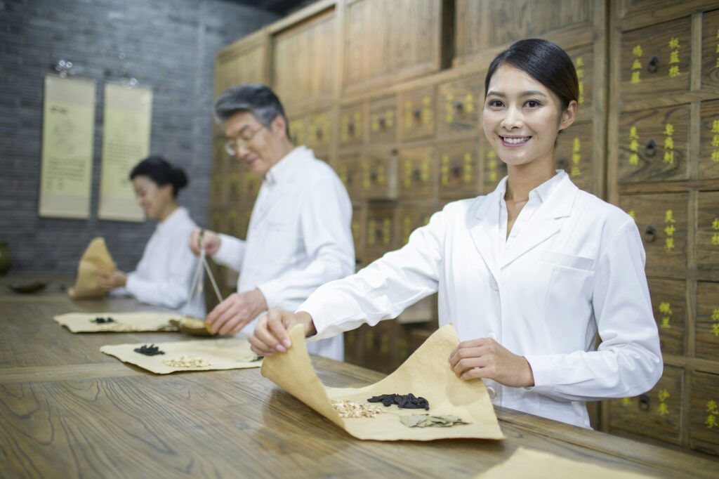 Chinese doctors in traditional Chinese medicine pharmacy