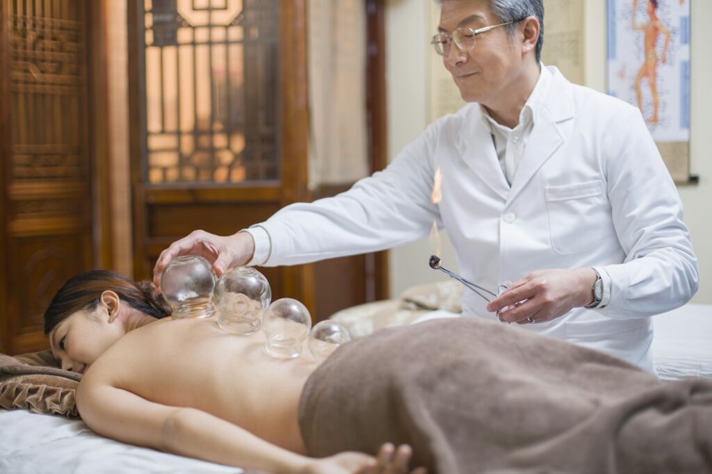 Young woman receiving vacuum cupping treatment